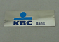 Las insignias del banco del recuerdo KBC a presión fundición con el níquel brillante, golpecito adhesivo